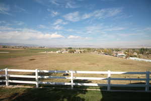 View of yard with a rural view