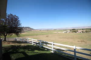 View of yard with a mountain view and a rural view