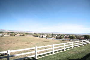 View of yard with a rural view and a mountain view