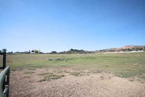 View of yard with a rural view