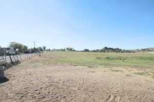 View of yard with a rural view