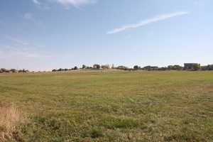 View of yard with a rural view