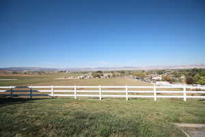 View of yard featuring a rural view and a mountain view