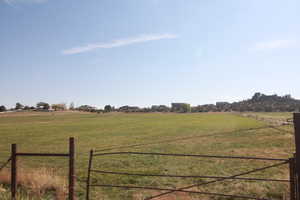 View of yard with a rural view