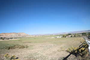 Property view of mountains with a rural view