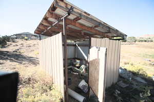 View of outbuilding with a rural view