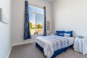 Guest bedroom with high ceilings