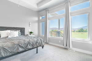 Carpeted bedroom featuring a mountain view