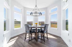 Dining room with a modern chandelier natural light and mountain views