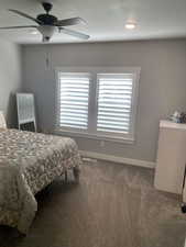 Bedroom with carpet and ceiling fan