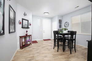 Dining space featuring light wood-type flooring