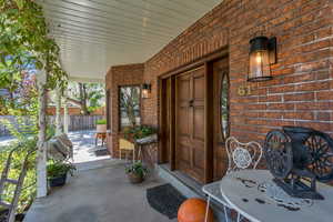 Doorway to property featuring a porch