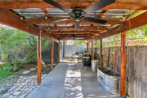 View of patio / terrace featuring a pergola and ceiling fan