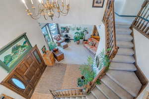 Interior space featuring carpet floors and a chandelier