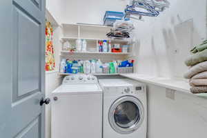 Washroom with washing machine and dryer