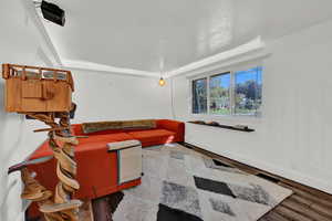 Interior space featuring ornamental molding and hardwood / wood-style floors