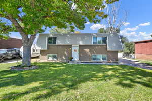 Front view of property with a lawn