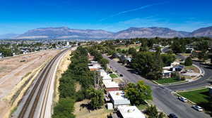 Birds eye view of property with a mountain view