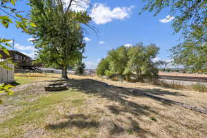 View of yard featuring a wooden deck