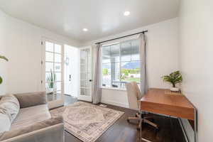 Office area featuring french doors and dark wood-type flooring