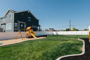 View of yard with a playground