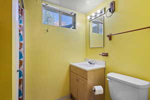 Bathroom with vanity and toilet