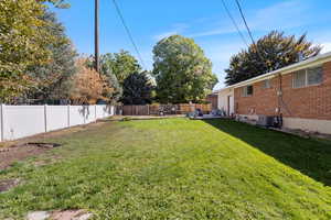 View of yard with central air condition unit