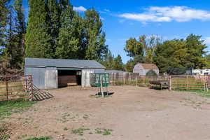 View of yard featuring an outdoor structure