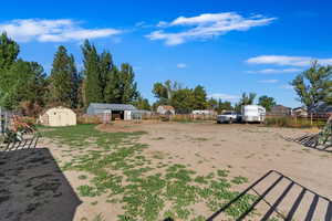 View of yard with a shed