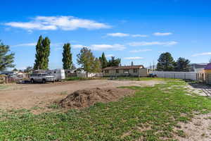 View of yard featuring a storage unit