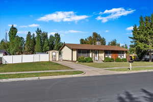 Ranch-style house with a front yard