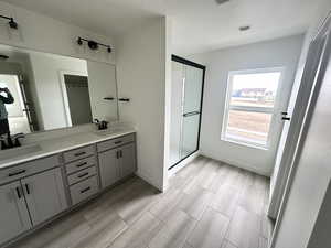 Bathroom with walk in shower and vanity