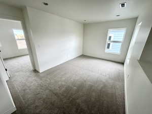 Empty room featuring carpet floors