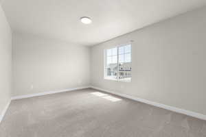 Empty room featuring carpet floors