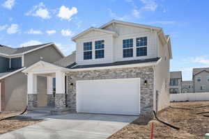 View of front of home with a garage