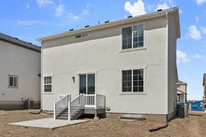 Back of property featuring cooling unit