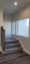 Stairway with hardwood / wood-style flooring