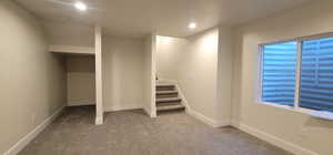 Basement with carpet flooring