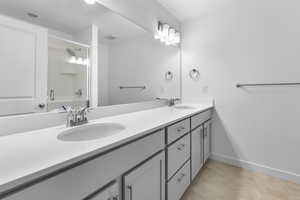 Bathroom featuring walk in shower and vanity