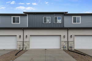 View of property with a garage