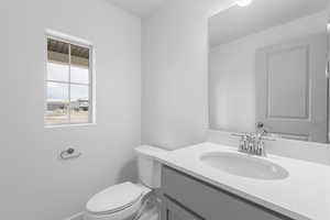 Bathroom with vanity and toilet