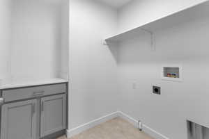 Laundry room with washer hookup, hookup for an electric dryer, hookup for a gas dryer, and light colored carpet