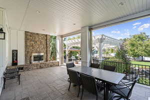 Covered Patio with Gas Fireplace off Kitchen