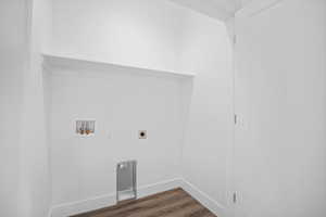 Laundry room featuring washer hookup, dark hardwood / wood-style flooring, and hookup for an electric dryer