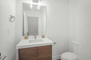 Bathroom with vanity and toilet