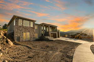 Back house at dusk with a mountain view