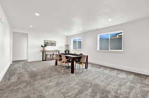 Dining area with carpet flooring