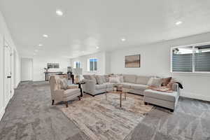 Living room featuring light colored carpet