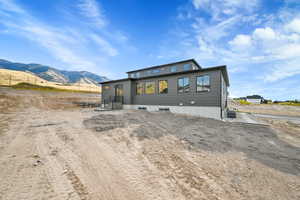 View of front facade with a mountain view and central AC