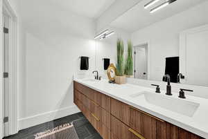 Bathroom with vanity and tile patterned flooring